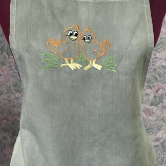 Green embroidered child's apron