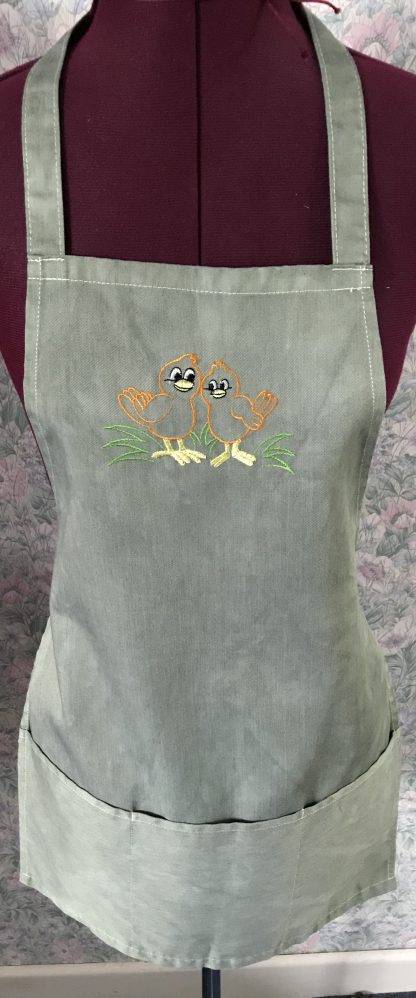Green embroidered child's apron