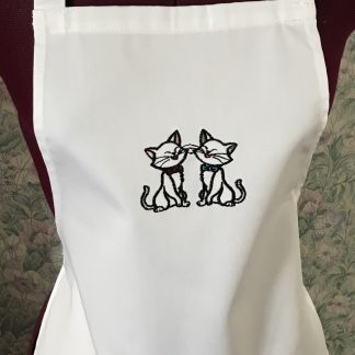 White embroidered child's apron