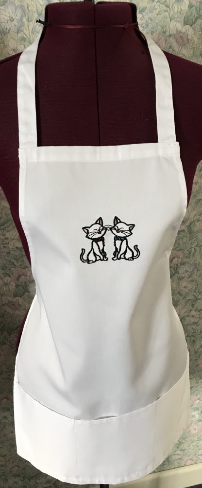 White embroidered child's apron
